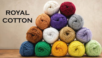A pyramid of Estako yarn skeins in fourteen colours, from cream and burgundy to green and yellow — a complete yarn weight guide at a glance.