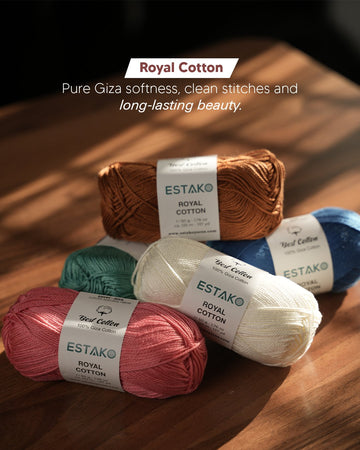 Five skeins of Estako Royal Cotton in copper, blue, teal, cream and rose, a glossy 100% mercerized Giza cotton.