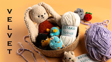 Basket of mini amigurumi and keychain plushies made with Estako Velvet chenille, with white and lilac Velvet skeins
