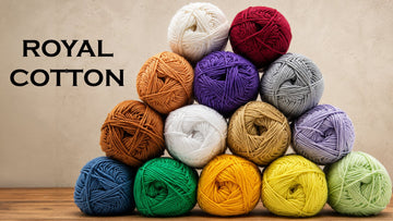 A pyramid of Royal Cotton yarn skeins in many colors, illustrating 2026 yarn color trends, Estako Yarns