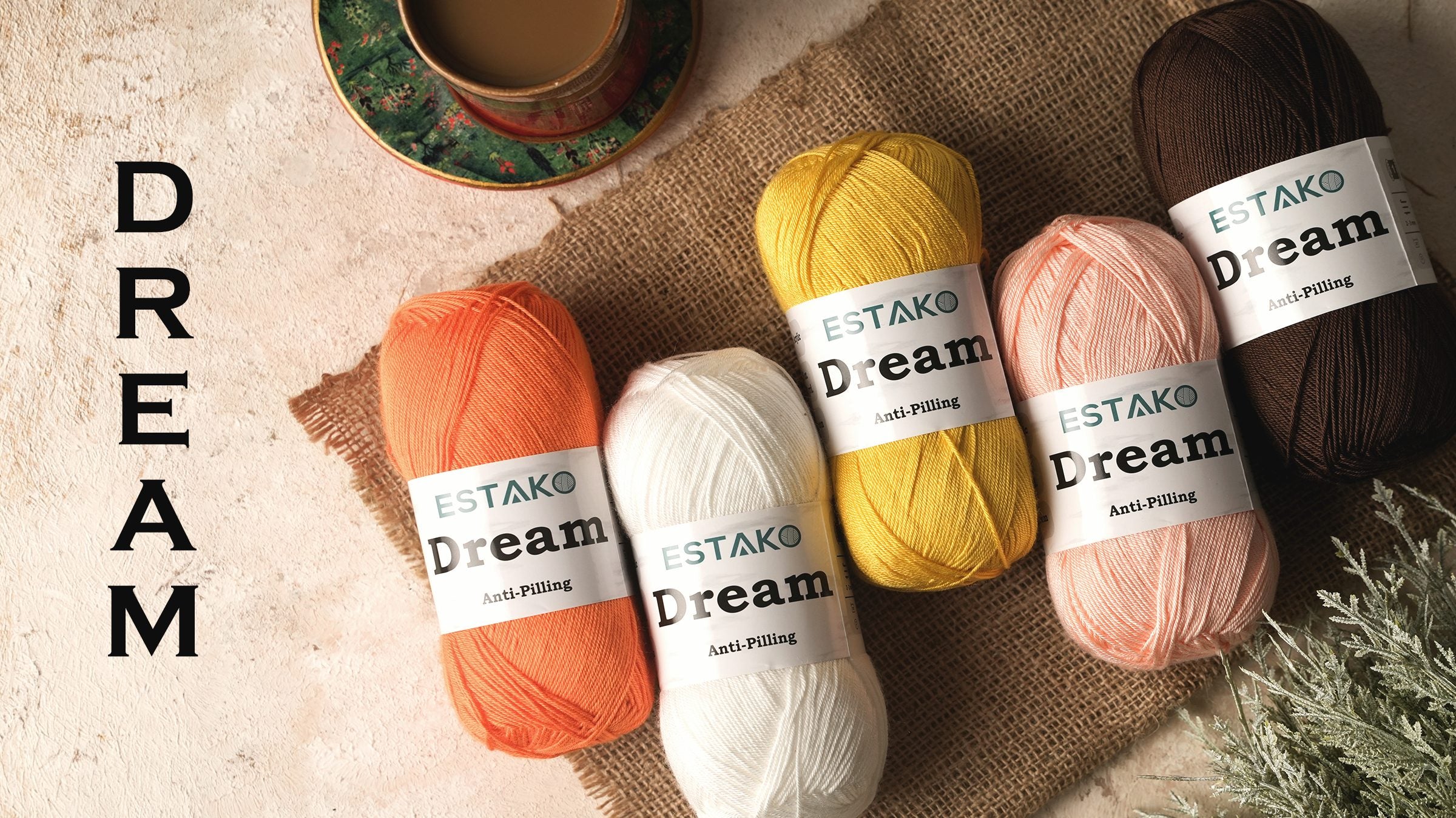 Five colourful Estako Star-Worsted skeins, each ball band showing the label where the dye-lot number is printed.