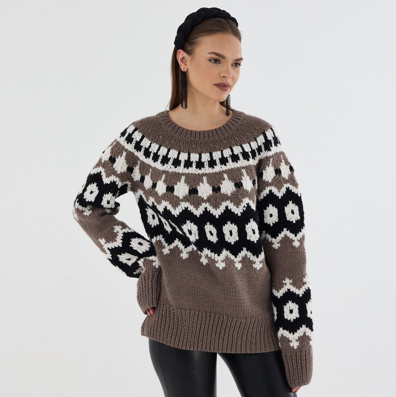 A model in a chunky Fair-Isle wool sweater knit from Estako MegaStar bulky yarn.